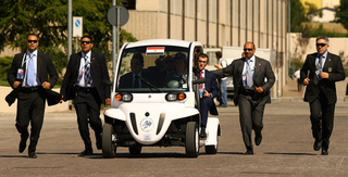 Illustration for article titled G8 Leaders Look Silly Shuttled Around In GEM Electric Cars